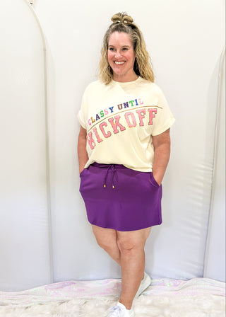 Purple skort with pockets and tie at waist. 