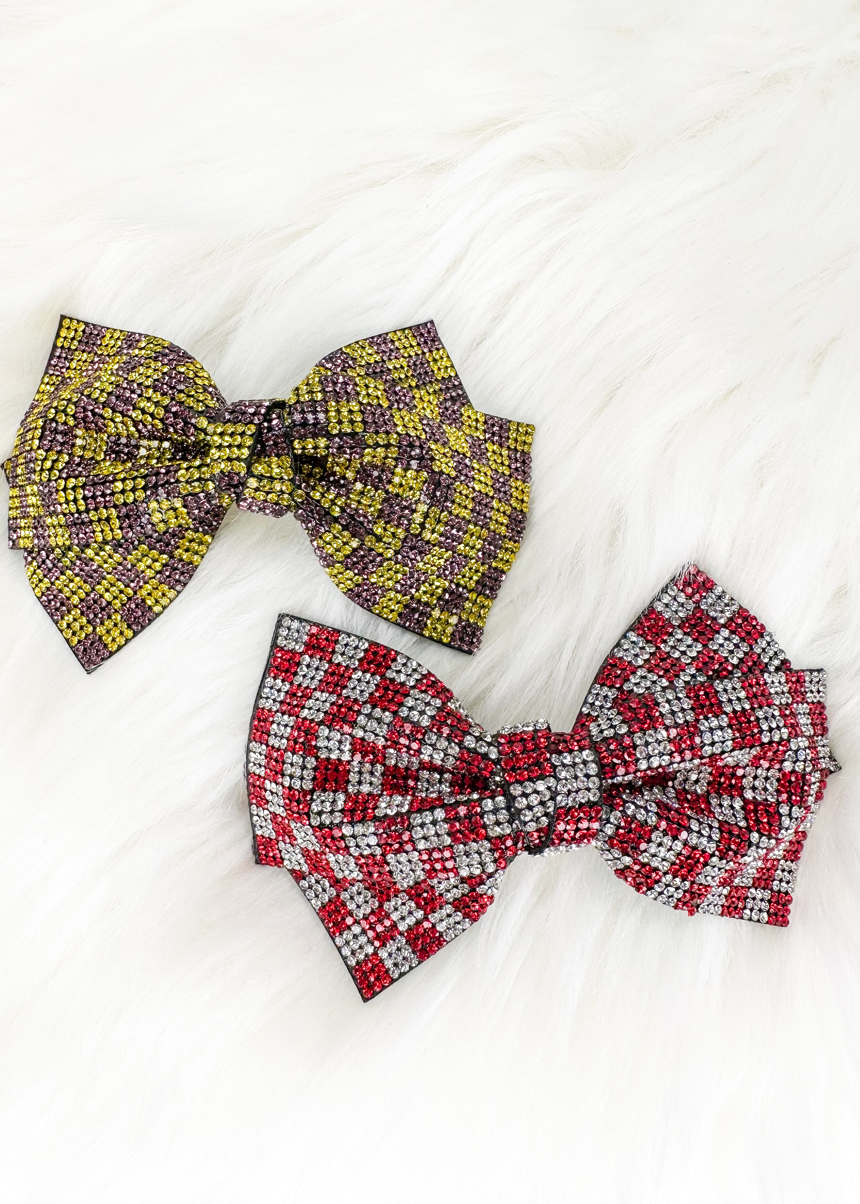 purple and gold sparkly hair bow and red and silver sparkly hair bow - both in a square checkerboard pattern