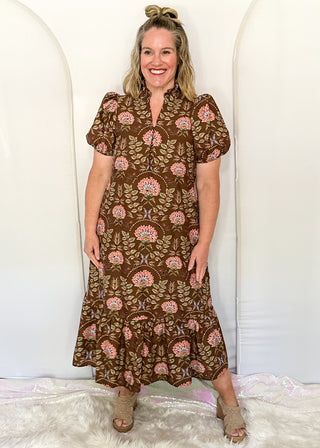 women wearing brown midi dress with floral pattern