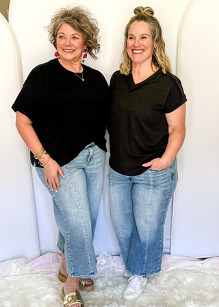 Light blue Judy Blue cropped wide leg jeans with vintage pocket design, soft wash, and mid rise waistband.