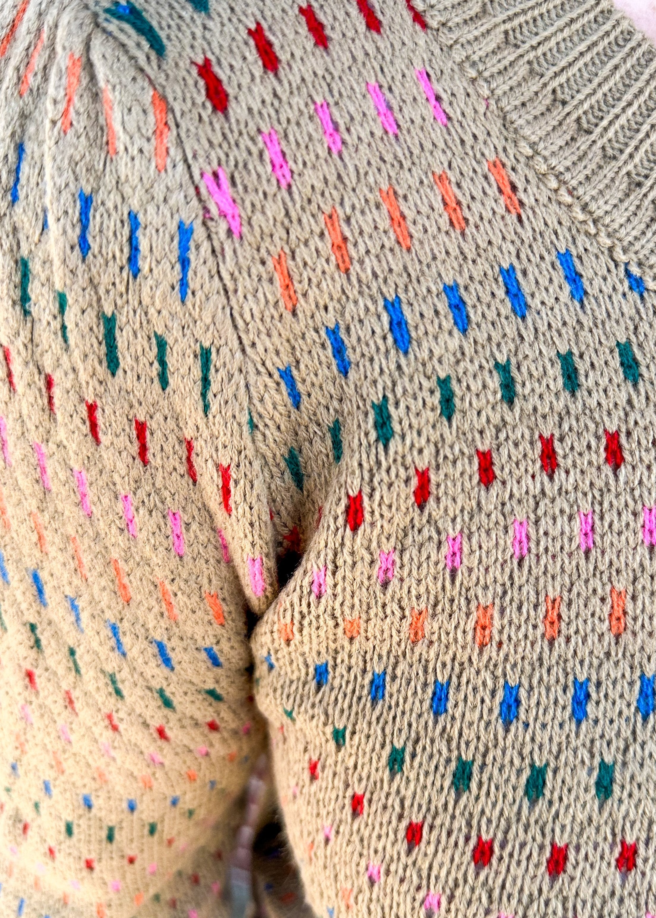 khaki long sleeve sweater with multi color dotted lines