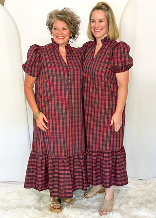 Two women wearing a plaid midi dress with puff sleeves and a tiered ruffle hem
