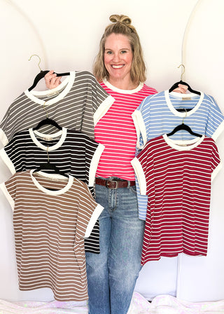 wide striped top with cuffed sleeves, and white banded rounded neckline.