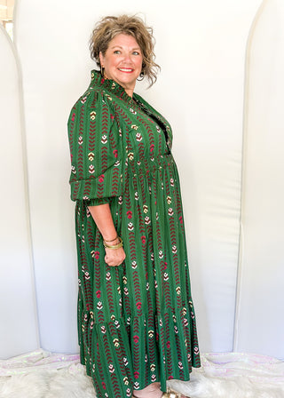Forest Green Maxi Dress with multi color flower and vine detail throughout.  3/4 length sleeve with smocking around the v-neck, sleeves and waist.  