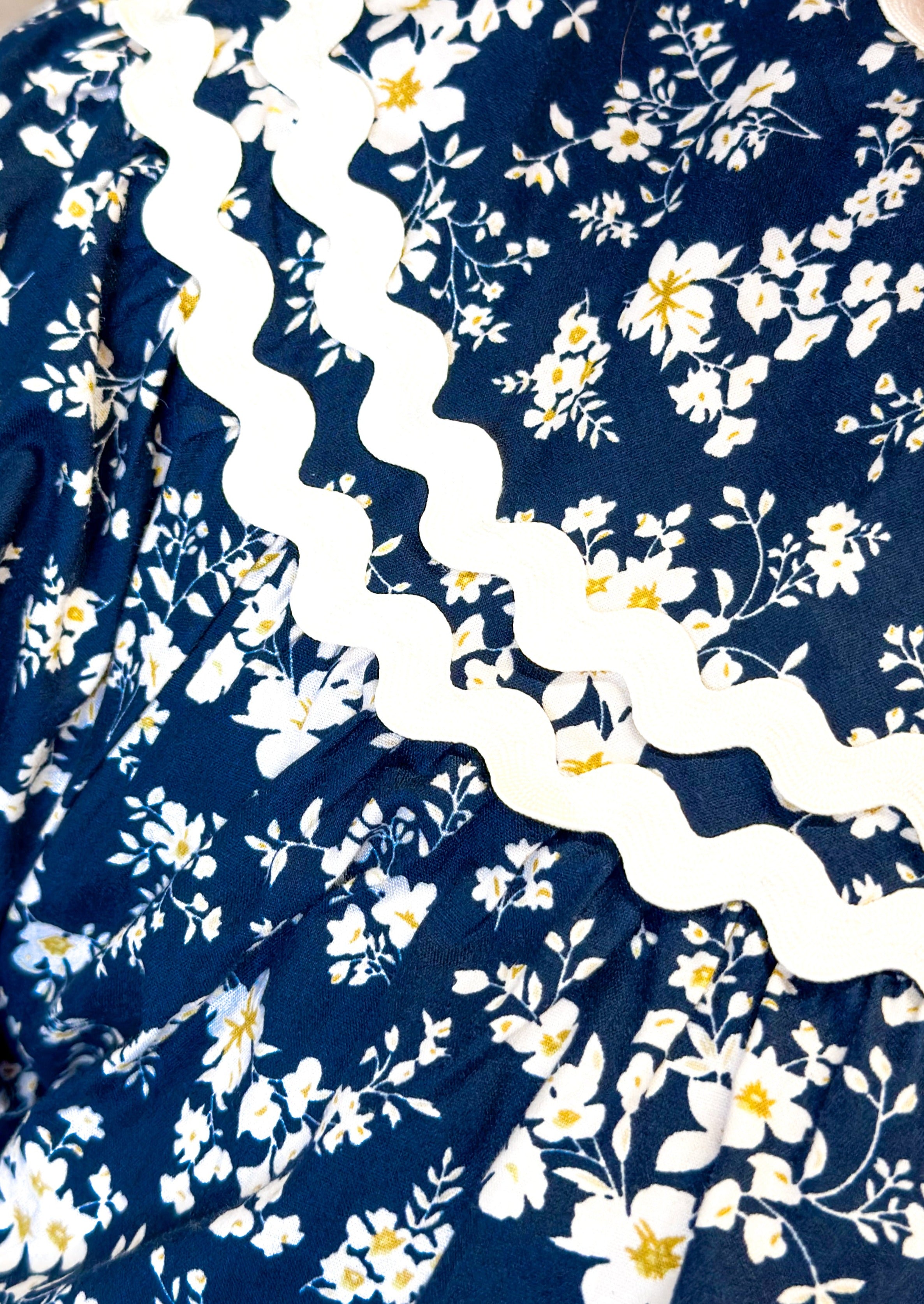 navy floral with hints of blue top - rick rack edging detail - small v-neck top with tie neck