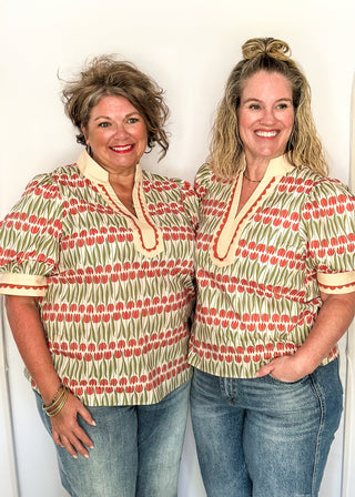 Large puff sleeve top with terracotta tulips and green leaves.  Contrast is ecru with terracotta scallop detail-short sleeve and v-neck.