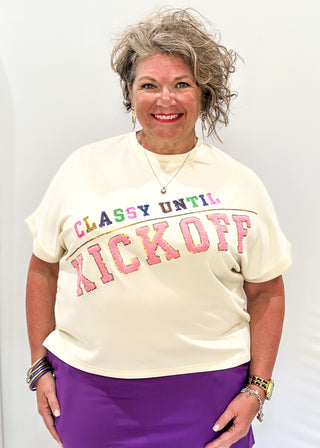 cream short sleeve crop tee with "CLASSY UNTIL KICKOFF" in chenille and sequin detail. 