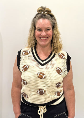 Cream open weave sleeveless sweater - need to wear something underneath - football sequin patches and black and cream varsity style trim around v-neck and bottom banding.