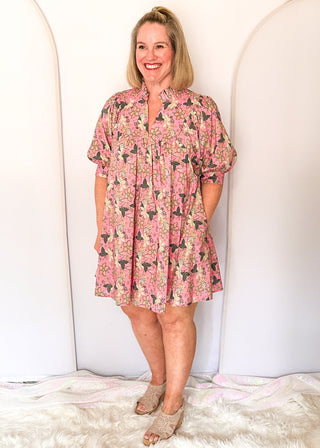 Pink floral short sleeve dress with lined construction, ruffle collar and puff sleeve. 