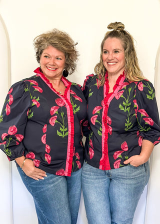 navy floral button up top with pink flowers and 2 shades of pink trim/ruffles along collar and down center