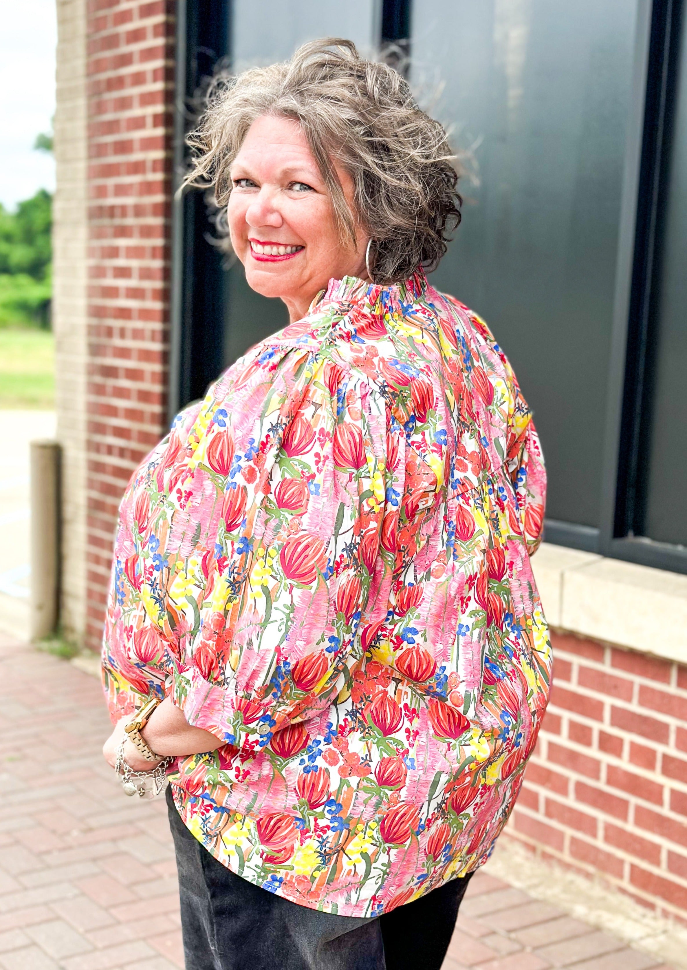 floral print short puff sleeve top with banded cuff w/button - v-neck - ruffle color - florals in red, yellow, pinks, blue