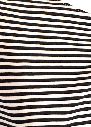 close up of striped knit dolman top with crew neckline and ribbed trim in black.