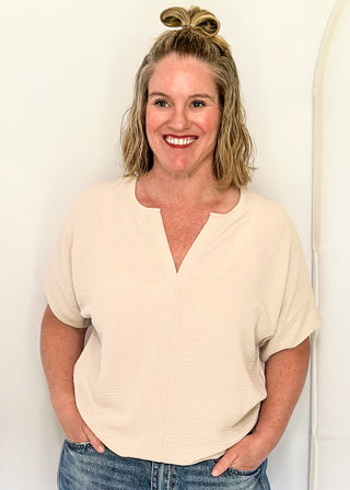 Solid textured blouse with a V-notch neckline, short sleeves
