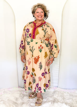 Camel background midi dress with multicolor floral design and long sleeves