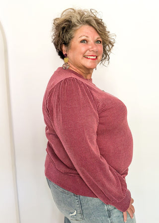 long sleeve ribbed top with cuff sleeve and small puff detail in shoulder. crew neck. 