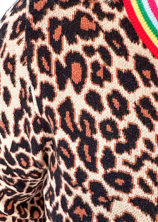 Long sleeve sweater in bold leopard print and colorful stripe collar.