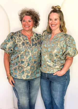 models in jacquard floral puff sleeve top in Gold Marine.