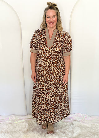 woman standing in leopard print Maxi Dress