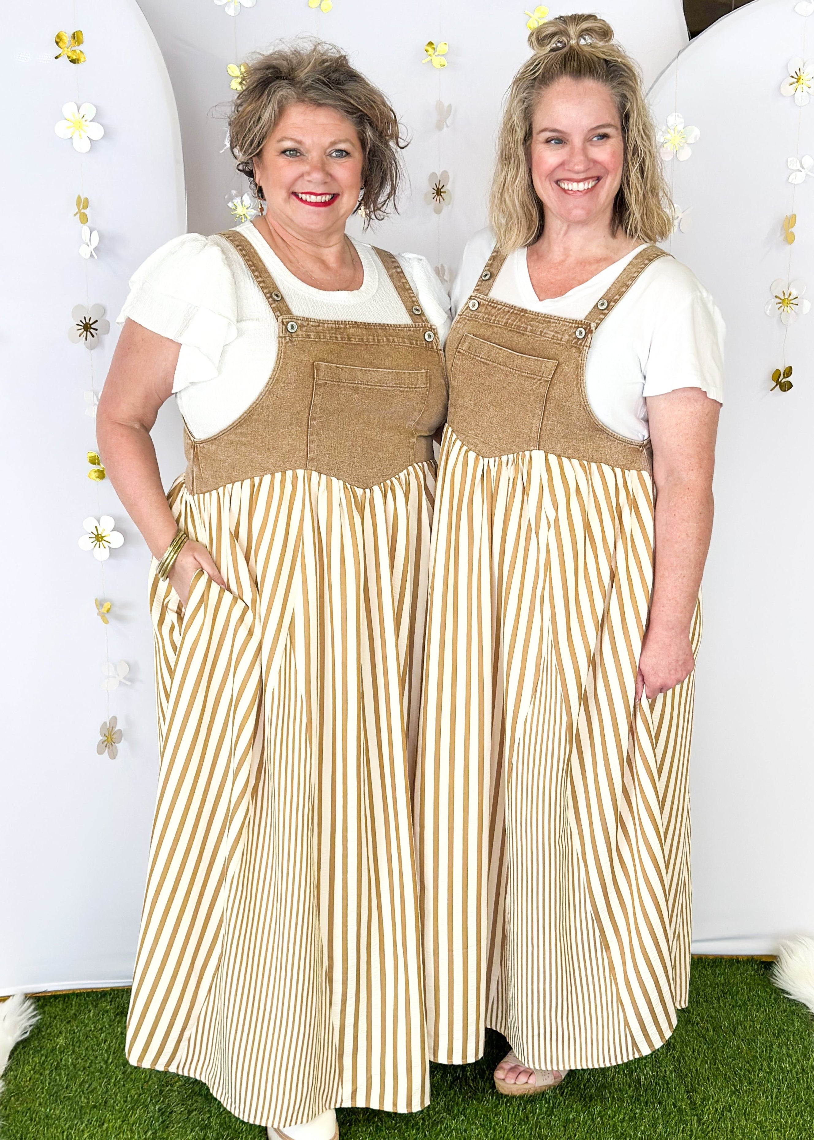 Maxi dress with pockets. brown vertical stripes on the bottom and brown denim overall top. Large front pocket and two buttons on either strap to adjust length.