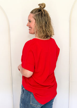 Solid textured blouse with a V-notch neckline, short sleeves