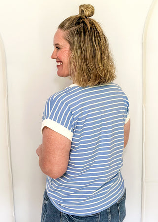 wide striped top with cuffed sleeves, and white banded rounded neckline.