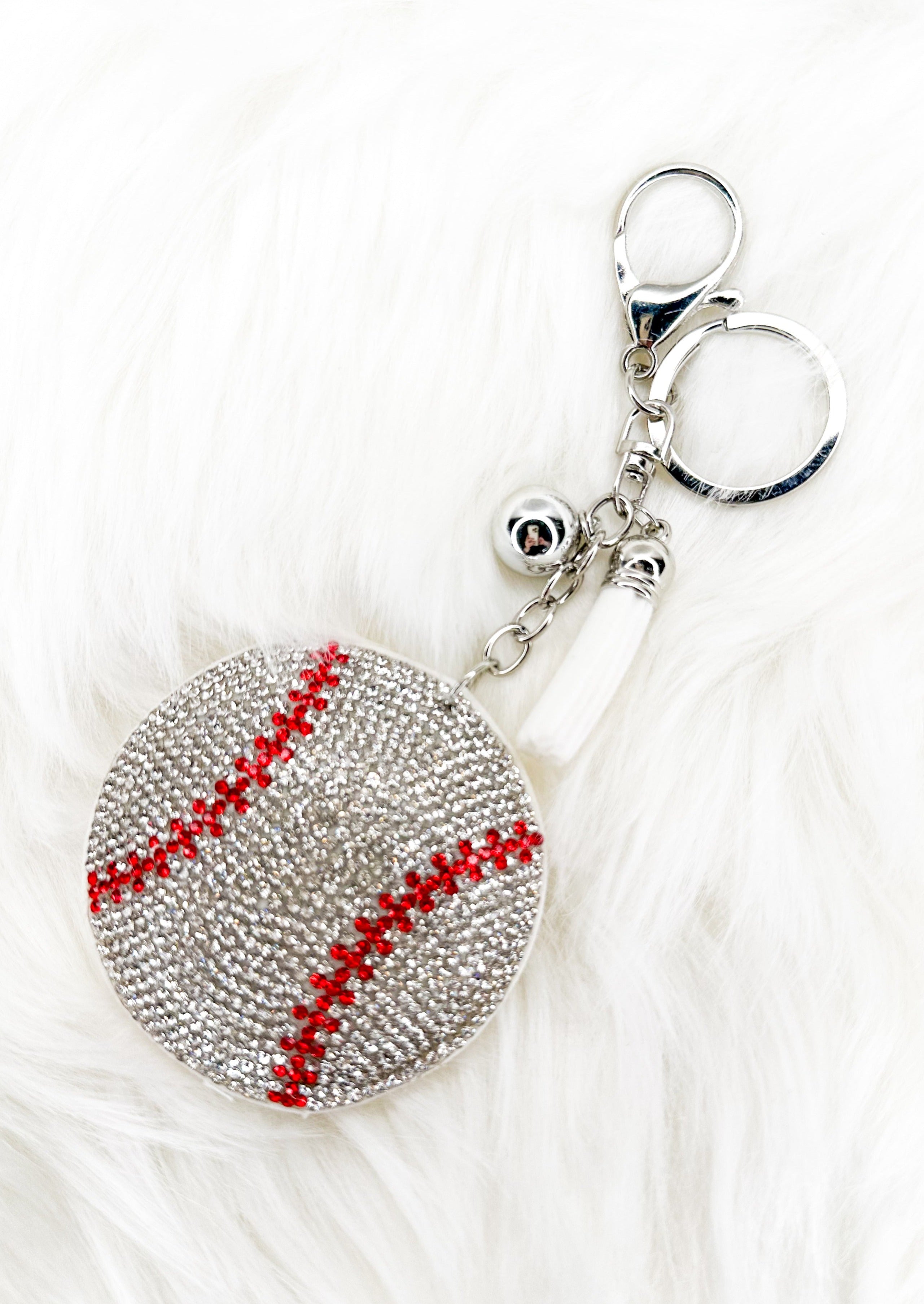 Baseball sparkly keychain with white tassel and silver hardware.