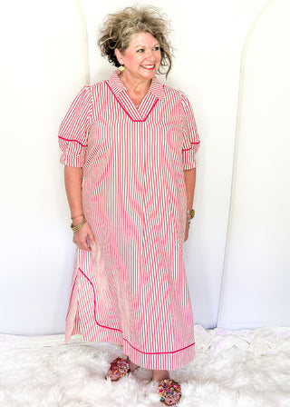 Raspberry and white vertical stripes on a short sleeve v neck midi dress. 