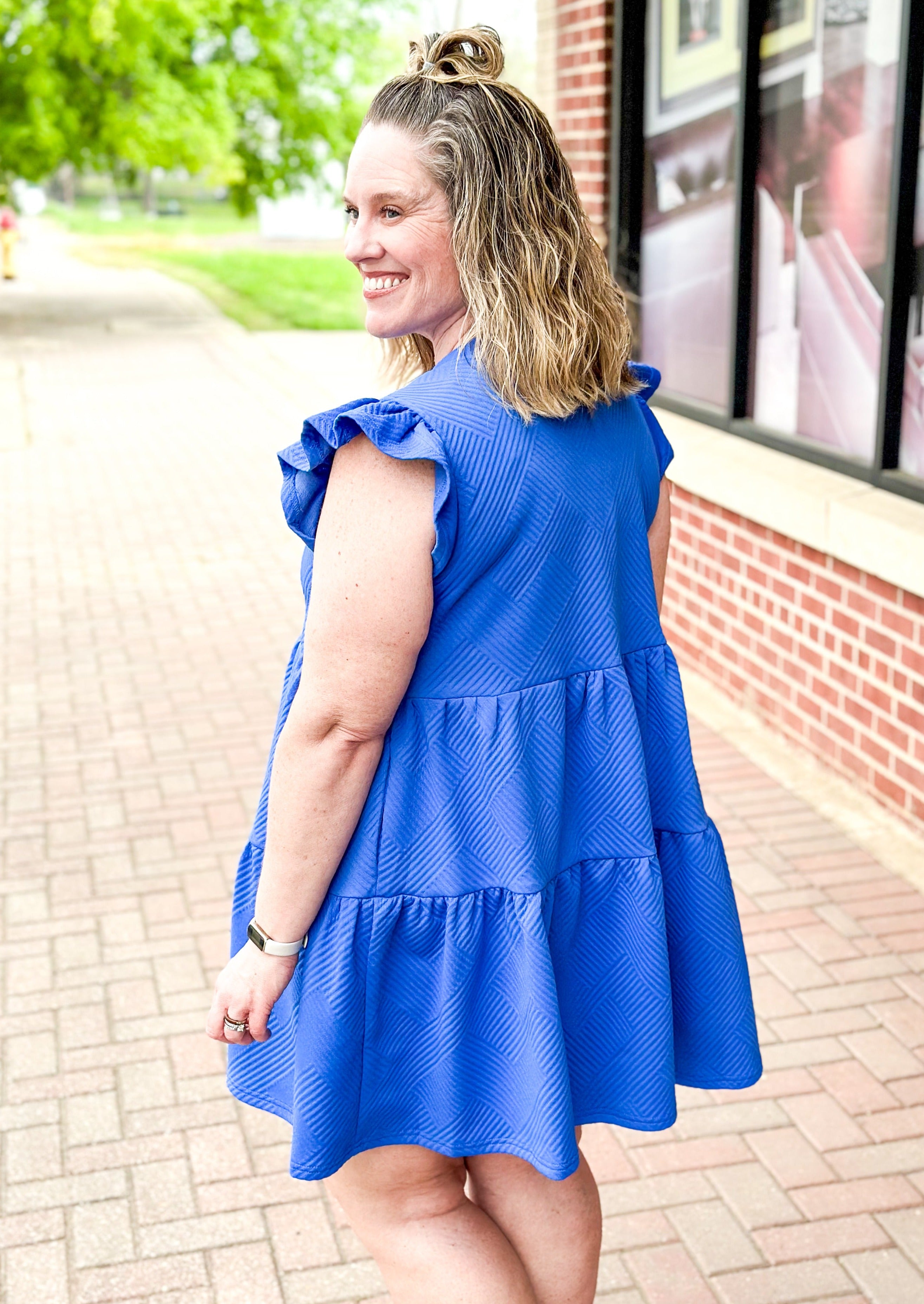 Blue textured tiered dress with ruffle sleeve, pockets, v-neck