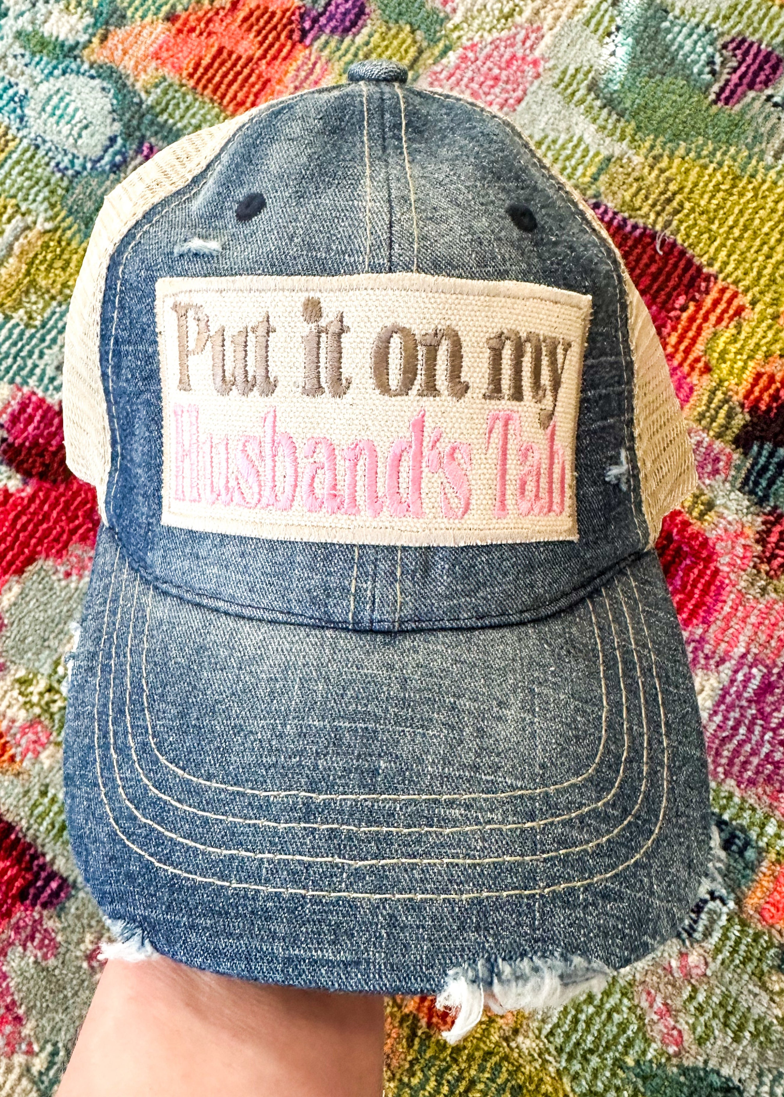 Put it on my husband's tab patch in khaki and pink.&nbsp; Denim colored front with khaki mesh back.&nbsp;

Snap back.