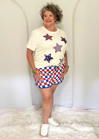 Red, white, and blue checkered shorts with drawstring elastic waist and pockets.