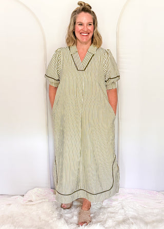 Vertical Stripe Dress in a relaxed silhouette with collar, solid olive contrast detail and pockets.