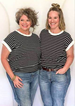 wide striped top with cuffed sleeves, and white banded rounded neckline