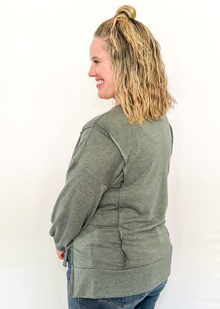 round neck oversized loose fit long sleeve with band cut edge detail with slits. 