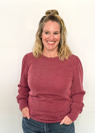 long sleeve ribbed top with cuff sleeve and small puff detail in shoulder. crew neck. 