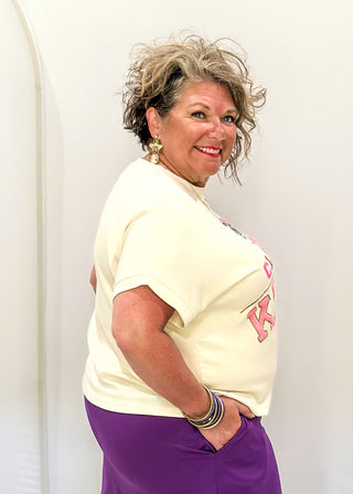 cream short sleeve crop tee with "CLASSY UNTIL KICKOFF" in chenille and sequin detail. 