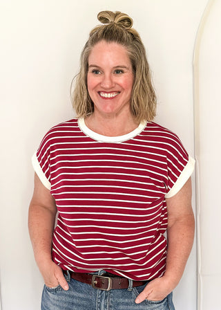 wide striped top with cuffed sleeves, and white banded rounded neckline.
