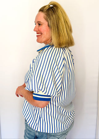 Women’s blue striped short sleeve 1/4 zip top with lightweight fabric, stripe elastic sleeve and collar detail.