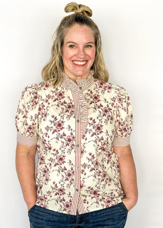 Ivory with small rust colored florals-short sleeve button up top. Rust and ivory stripe ruffle collar and sleeve binding.  