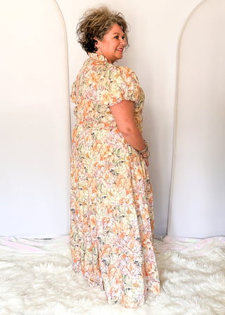 Floral maxi dress with short puff sleeves, elastic waist, and flowy maxi skirt