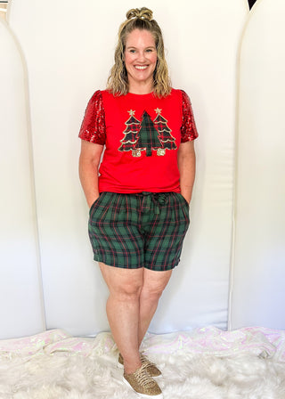 Green and red plaid shorts with side pockets,and a matching belt. 