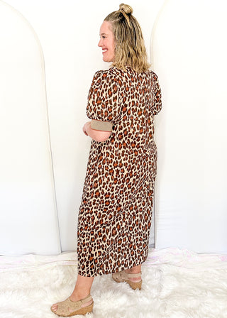woman standing profile in leopard print Maxi Dress