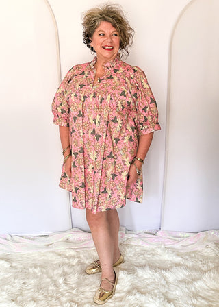 Pink floral short sleeve dress with lined construction, ruffle collar and puff sleeve. 