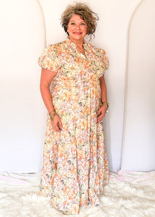 Floral maxi dress with short puff sleeves, elastic waist, and flowy maxi skirt