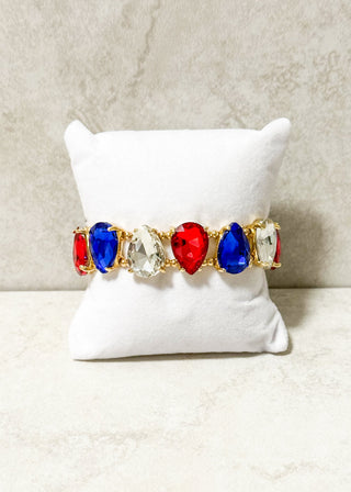 Red, Blue and Clear Jeweled stretchy bracelet with gold beading.