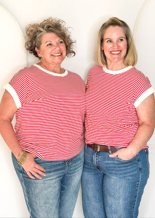 Red and white striped short sleeve top with white banding on sleeve and collar.  