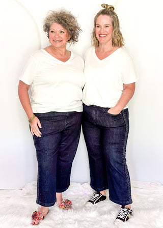 Women's Judy Blue dark wash jeans with braided side trim, high-rise waist, and classic five-pocket styling.