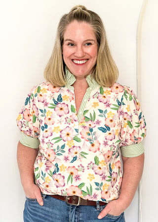 Women’s floral blouse with button front detail and green striped contrast accents