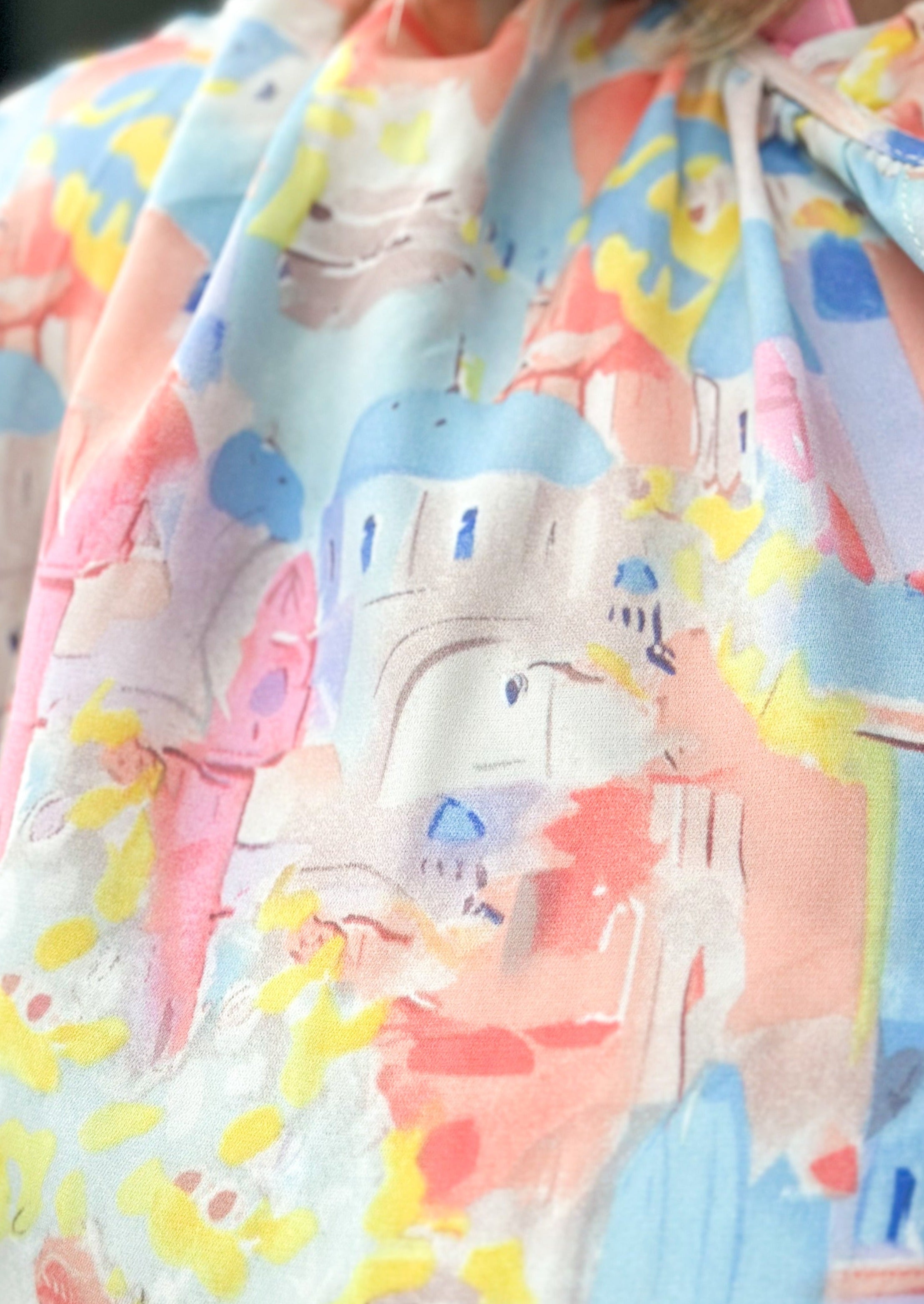 Pastel abstract print with building - v-neck with tie and ruffle - dolman 3/4 sleeve with elastic - lightweight