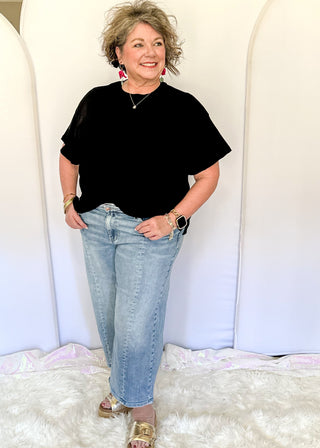 Light blue Judy Blue cropped wide leg jeans with vintage pocket design, soft wash, and mid rise waistband.