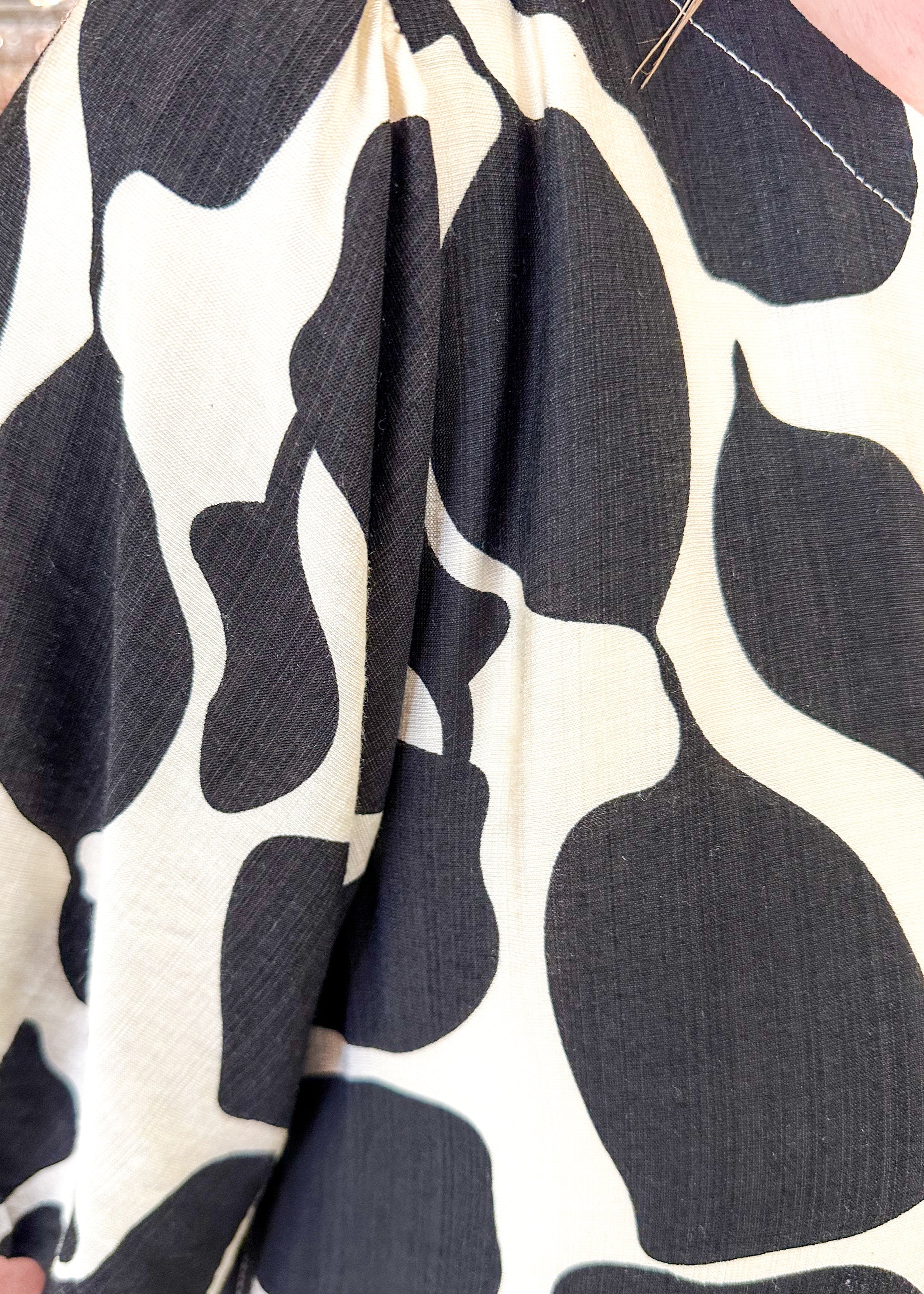 black abstract print on a cream base dress w/pockets and puff sleeve - lined